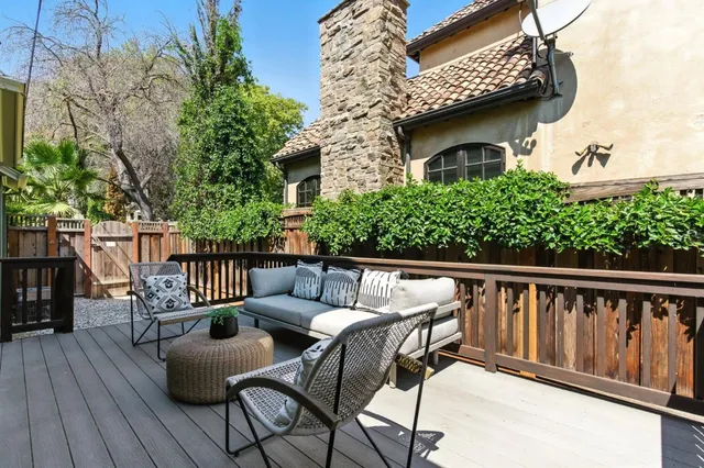 a view of a yard with large trees