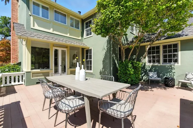 a view of a tree in the middle of a yard