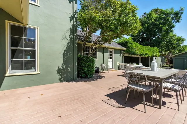 a view of a swimming pool with an outdoor seating and a yard