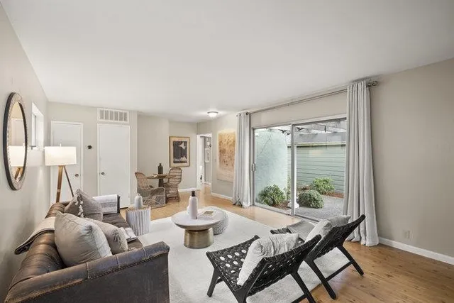 a front view of a house with a garden