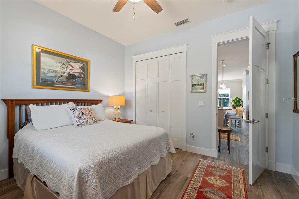 65 Sandy Beach Way Palm Coast, FL 32137 - Photo 26 of 85 a bedroom with a bed and a painting on the wall