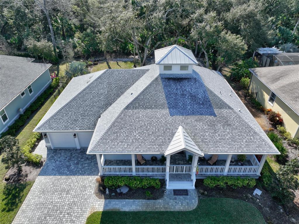 65 Sandy Beach Way Palm Coast, FL 32137 - Photo 4 of 85 a aerial view of a house with a yard plants and large tree