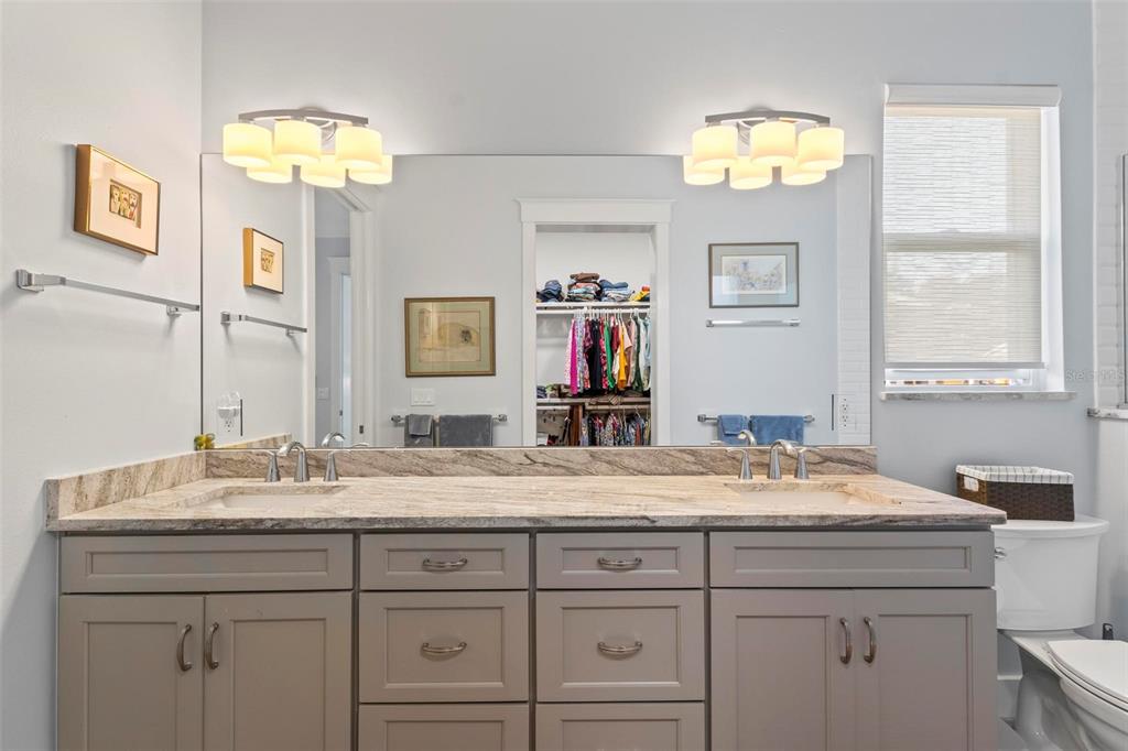 65 Sandy Beach Way Palm Coast, FL 32137 - Photo 68 of 85 a bathroom with a sink and a mirror