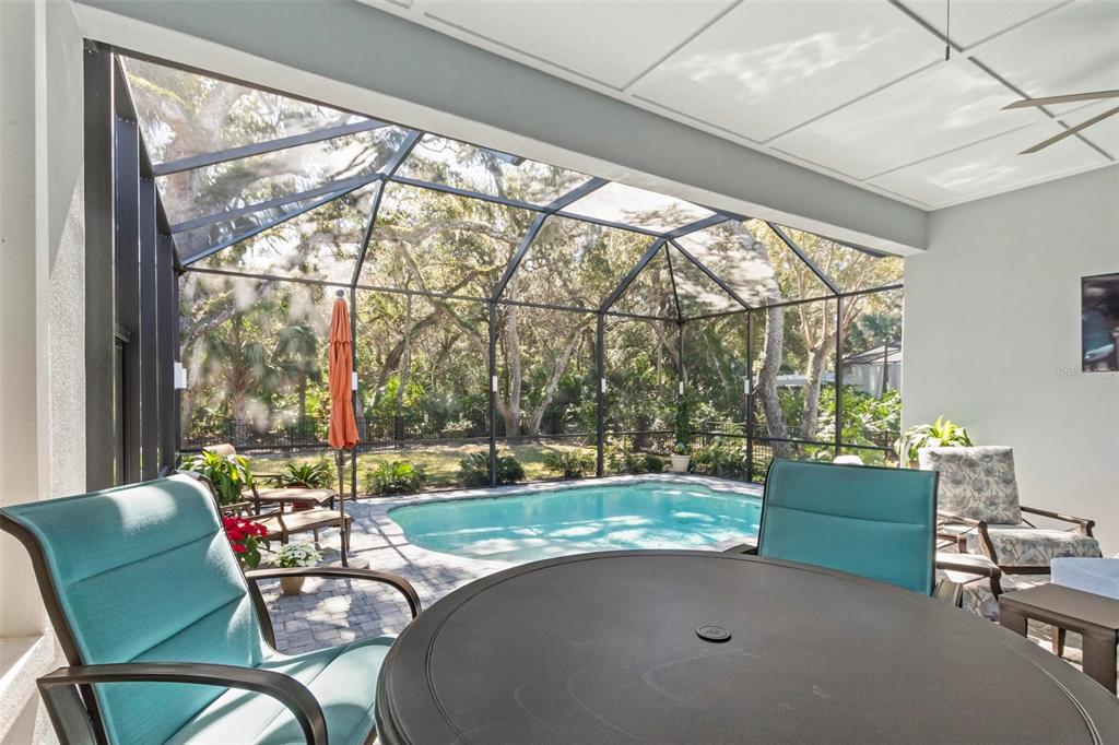 65 Sandy Beach Way Palm Coast, FL 32137 - Photo 79 of 85 a living room with a floor to ceiling window and wooden floor
