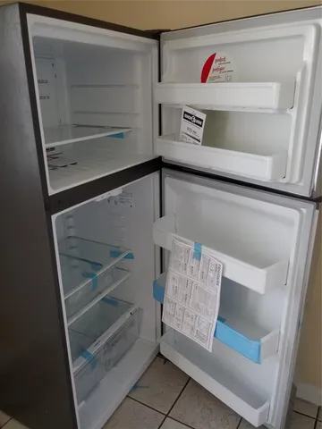 a utility room with storage and utility