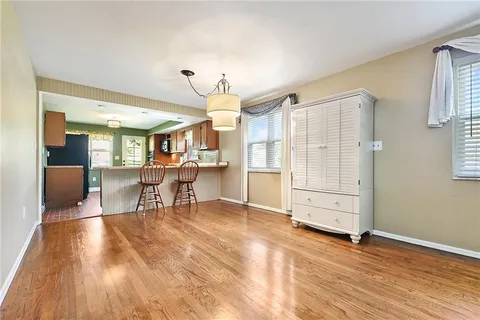 a view of a livingroom with furniture and a window