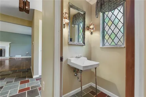 a bathroom with a sink and a mirror