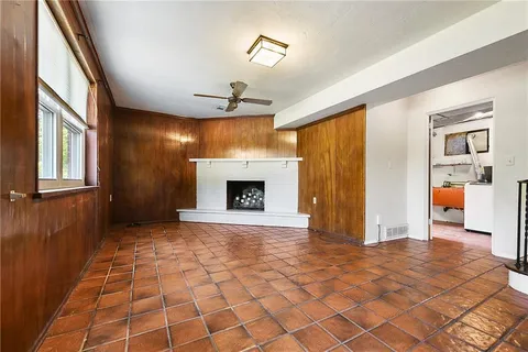 a view of an empty room with a fireplace