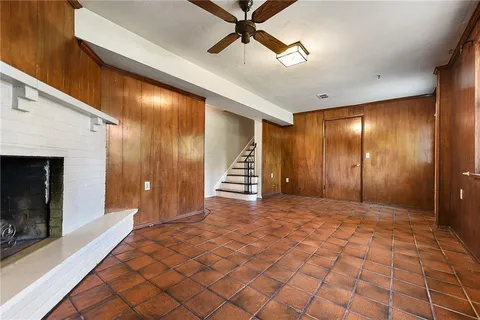 a view of an empty room with a fireplace