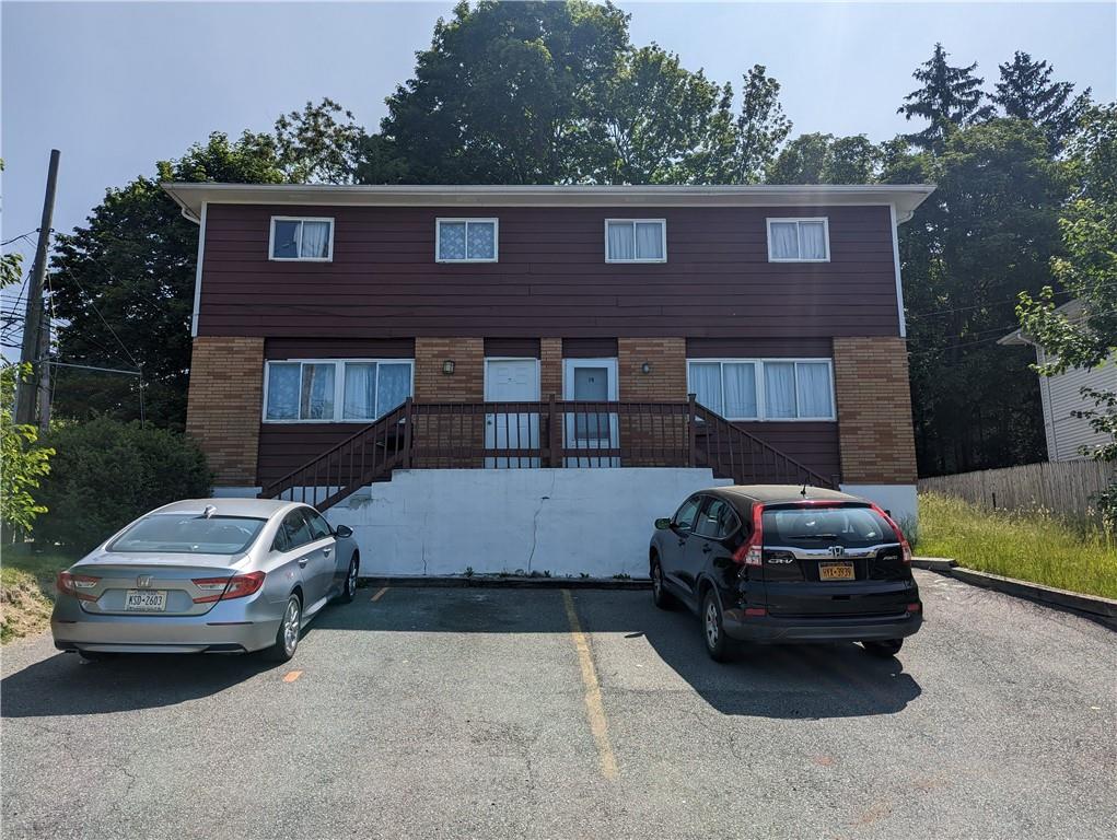 a car parked in front of a house