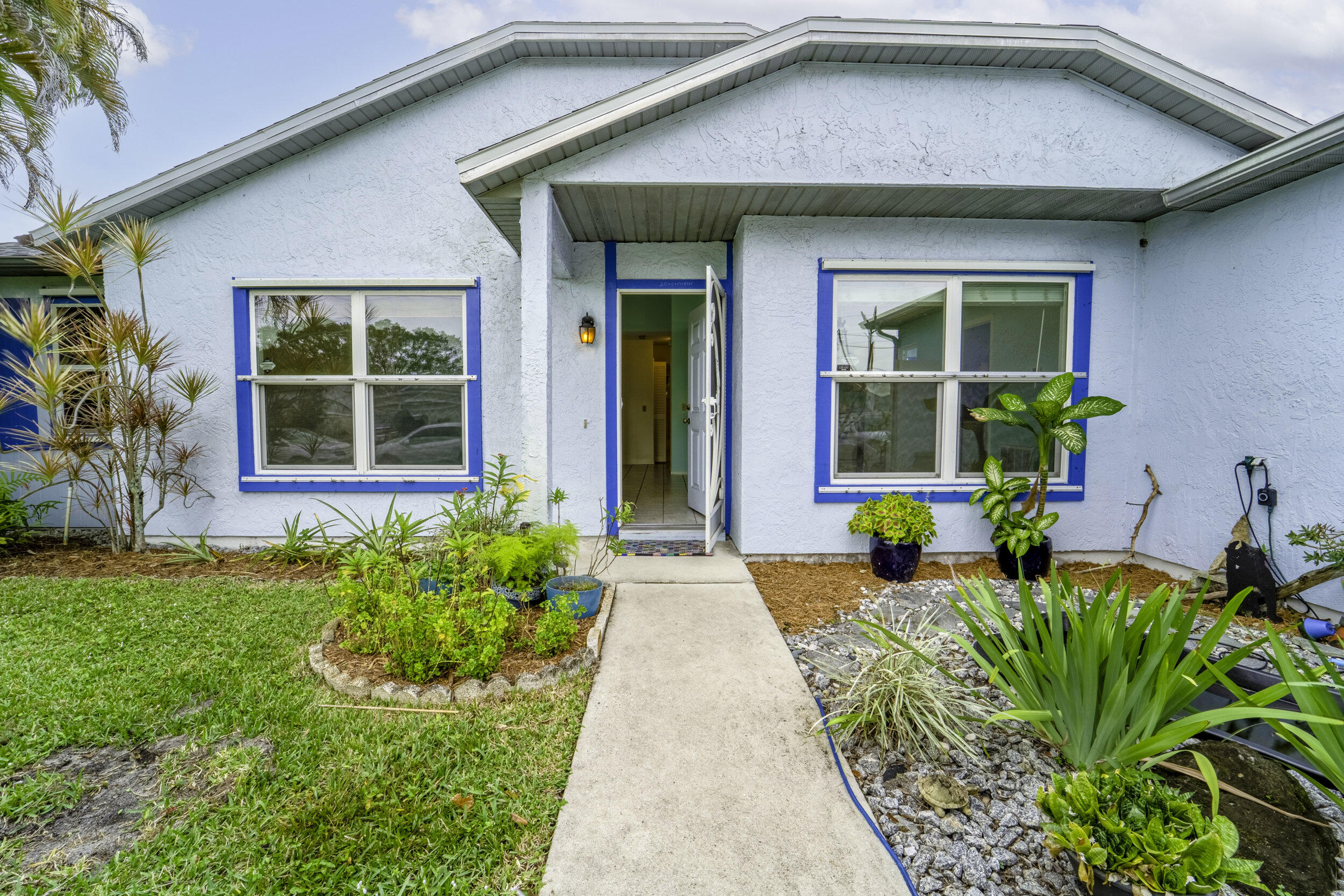 6851 Northwest Jorgensen Road Port St. Lucie, FL 34983 - Photo 4 of 37 5_front door