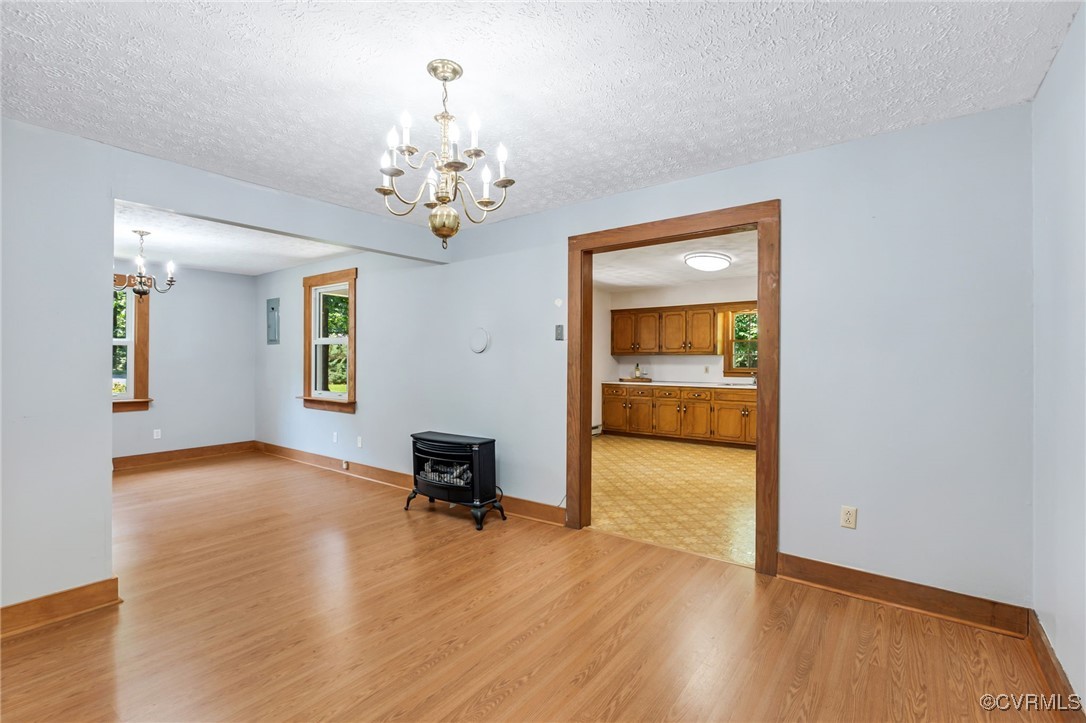 2812 Chapel Road New Canton, VA 23123 - Photo 12 of 32 a view of a livingroom with a chandelier furniture and windows