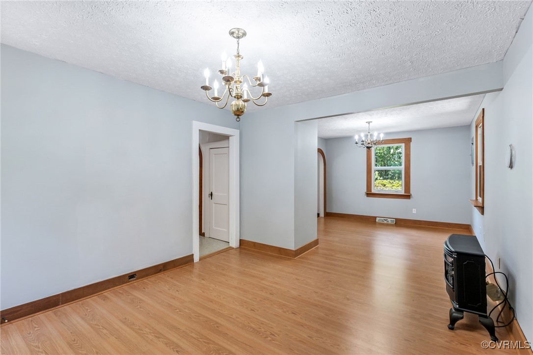 2812 Chapel Road New Canton, VA 23123 - Photo 14 of 32 a view of an empty room with wooden floor and a window