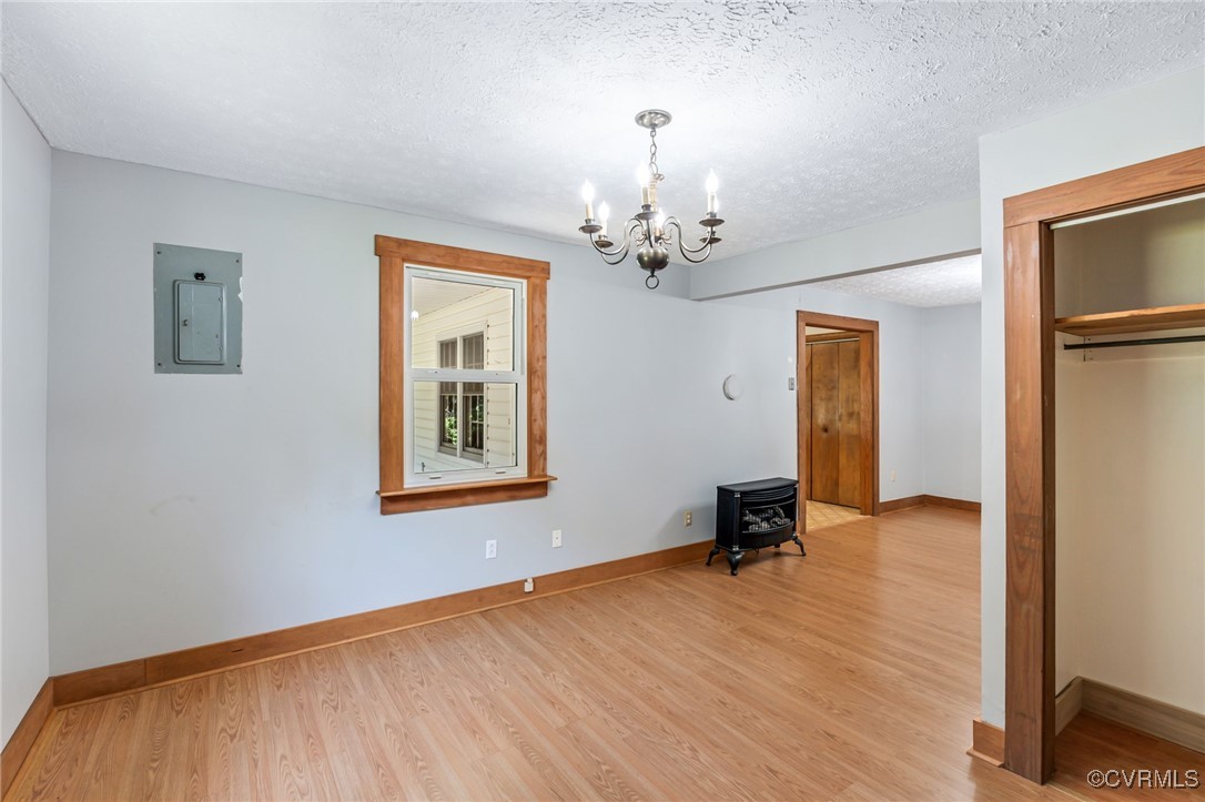 2812 Chapel Road New Canton, VA 23123 - Photo 15 of 32 a view of a room with wooden floor a mirror and a window