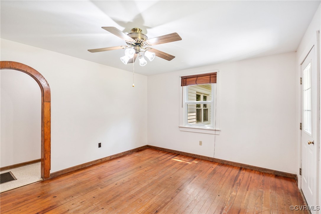 2812 Chapel Road New Canton, VA 23123 - Photo 5 of 32 a view of an empty room with wooden floor and a window