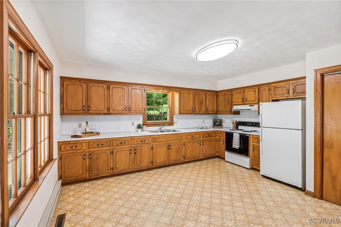 2812 Chapel Road New Canton, VA 23123 - Photo 8 of 32 a kitchen with a refrigerator and a sink