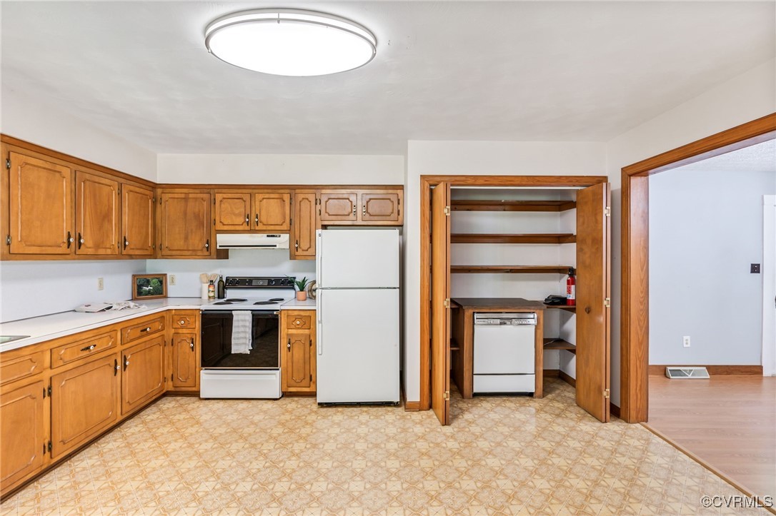 2812 Chapel Road New Canton, VA 23123 - Photo 9 of 32 a view of a kitchen with stainless steel appliances granite countertop a stove and a refrigerator