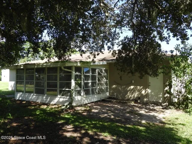a plant is in front of a house