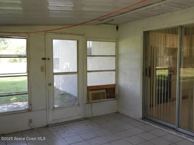 a view of an empty room and window