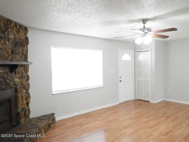 a view of a livingroom with a fireplace