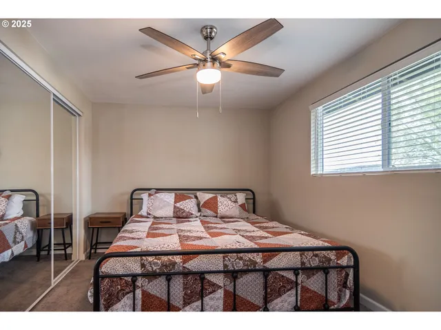 a bedroom with a bed and a television