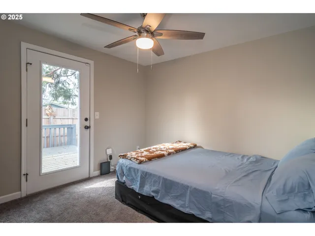 a view of wooden deck and a backyard