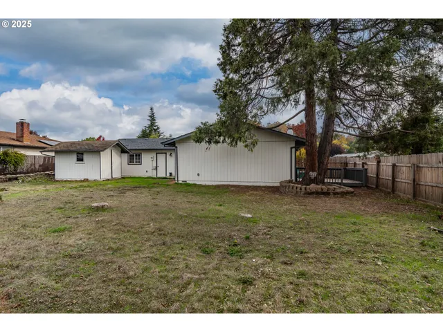 a backyard of a house with lots of green space