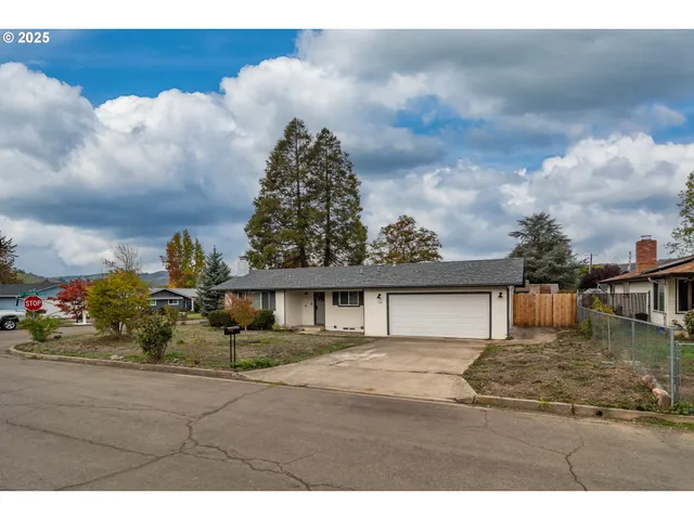 a living room with furniture and flowers