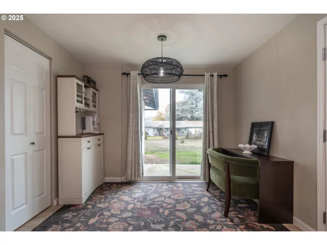 a kitchen with a refrigerator and a stove top oven