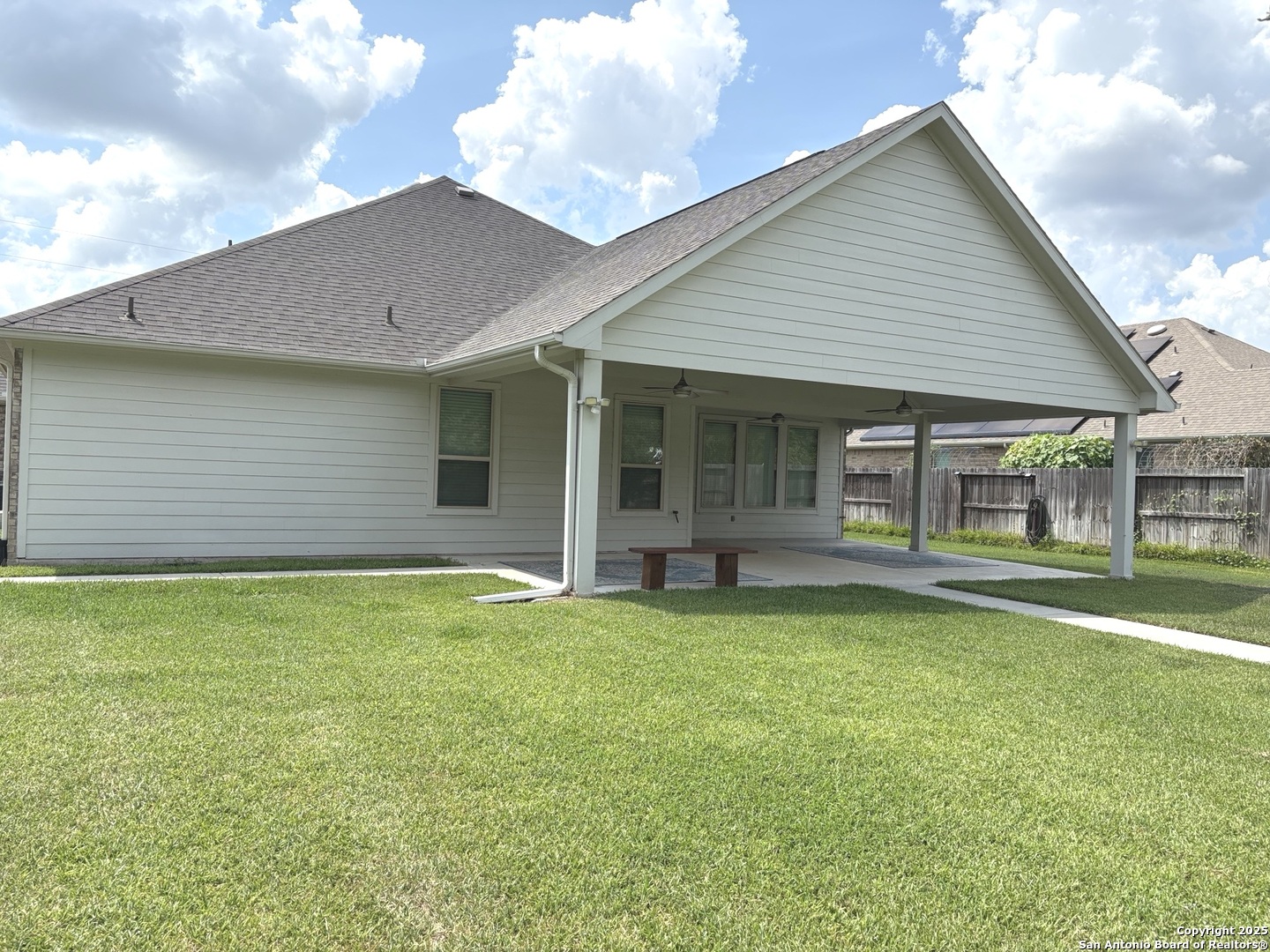 6358 Rolling Hills Road Conroe, TX 77303 - Photo 18 of 23 a backyard of a house with table and chairs