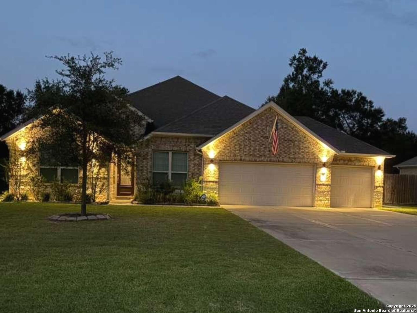 6358 Rolling Hills Road Conroe, TX 77303 - Photo 2 of 23 a front view of a house with a yard