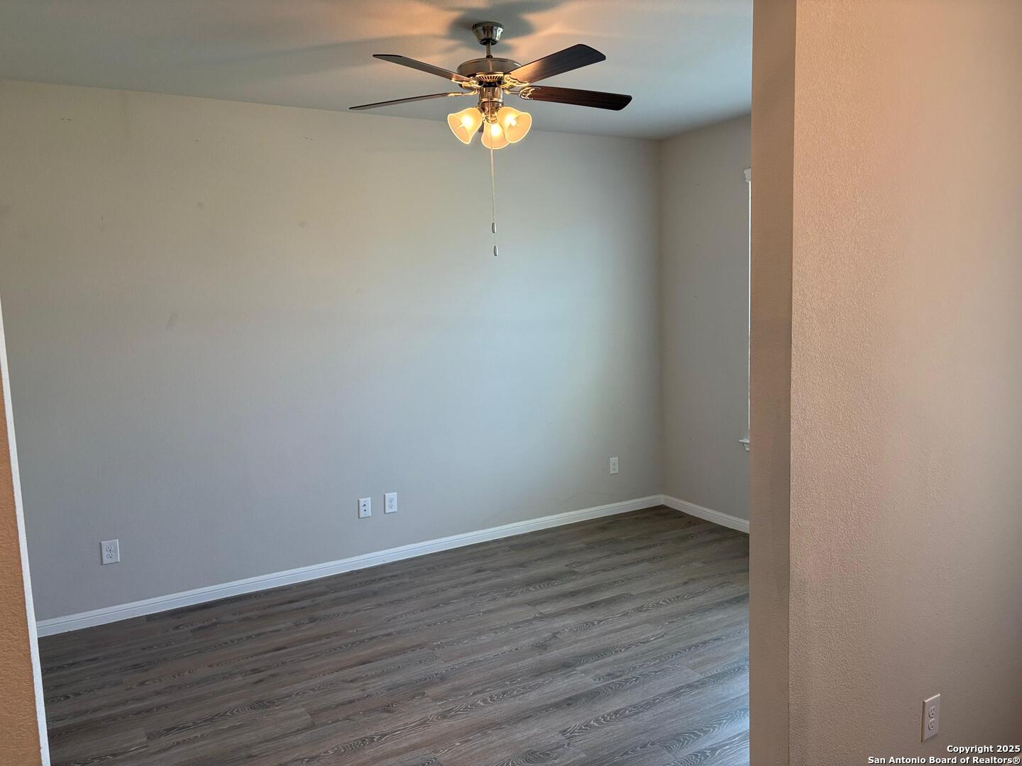 6358 Rolling Hills Road Conroe, TX 77303 - Photo 4 of 23 a view of an empty room with wooden floor