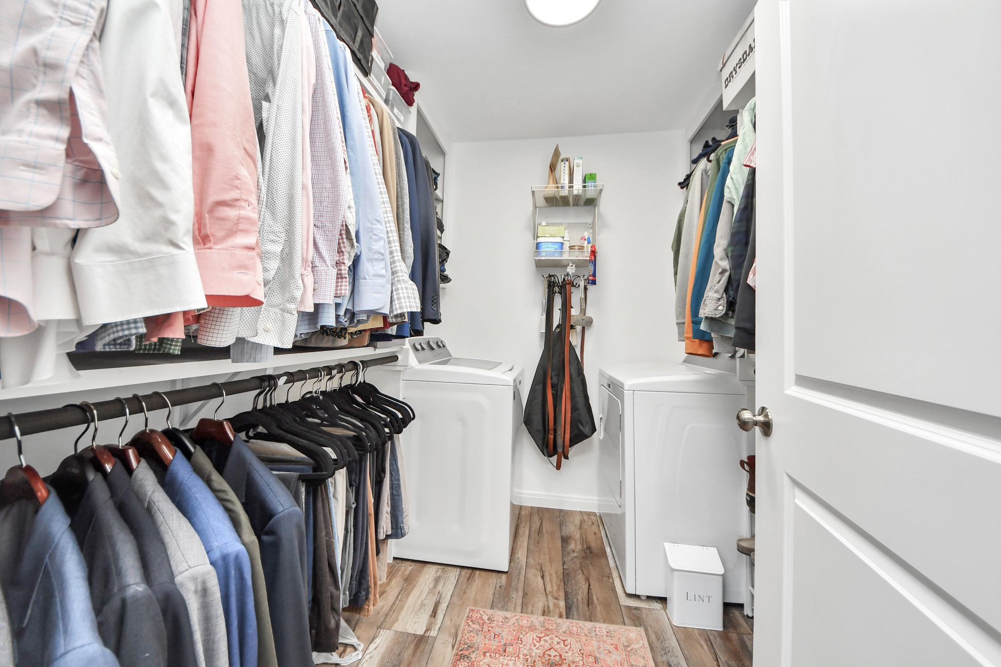 3224 Timmons Lane, Unit 168 Houston, TX 77027 - Photo 16 of 36 a view of walk in closet with clothes and shoes