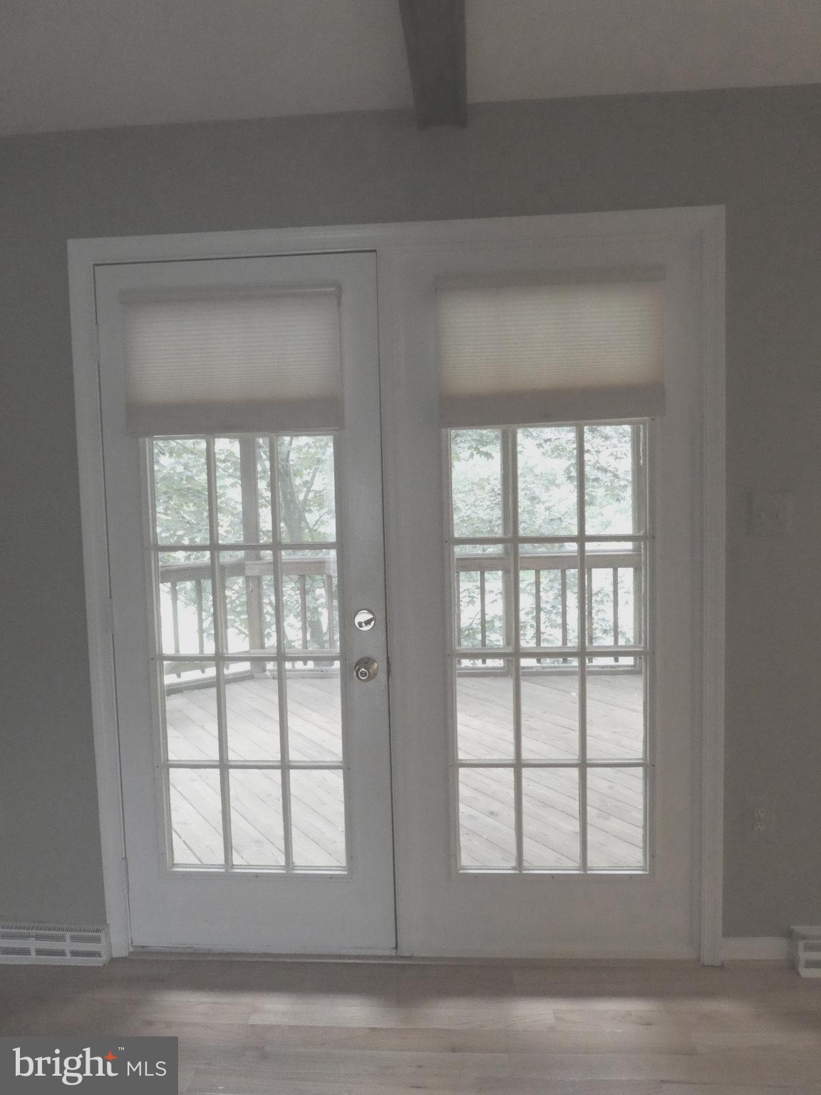 8710 Shadowlake Way Springfield, VA 22153 - Photo 4 of 80 Doors in Family Room lead to Ample Screened Porch