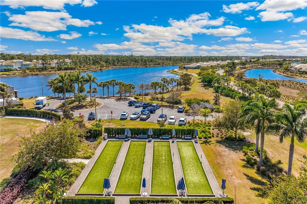 6939 Cay Court Naples, FL 34113 - Photo 31 of 31 Bird's eye view of a pool area and a large body of water