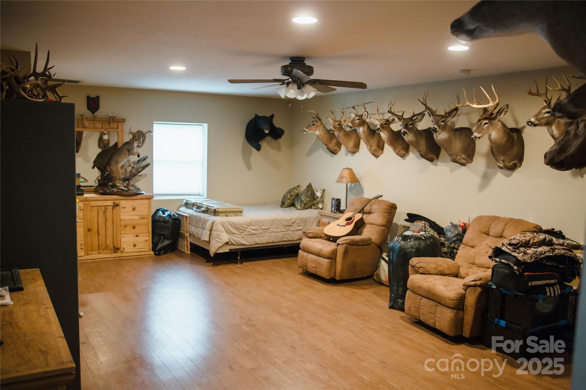 1086 Carters Ridge Road Spruce Pine, NC 28777 - Photo 19 of 47 a bedroom with furniture and a couch