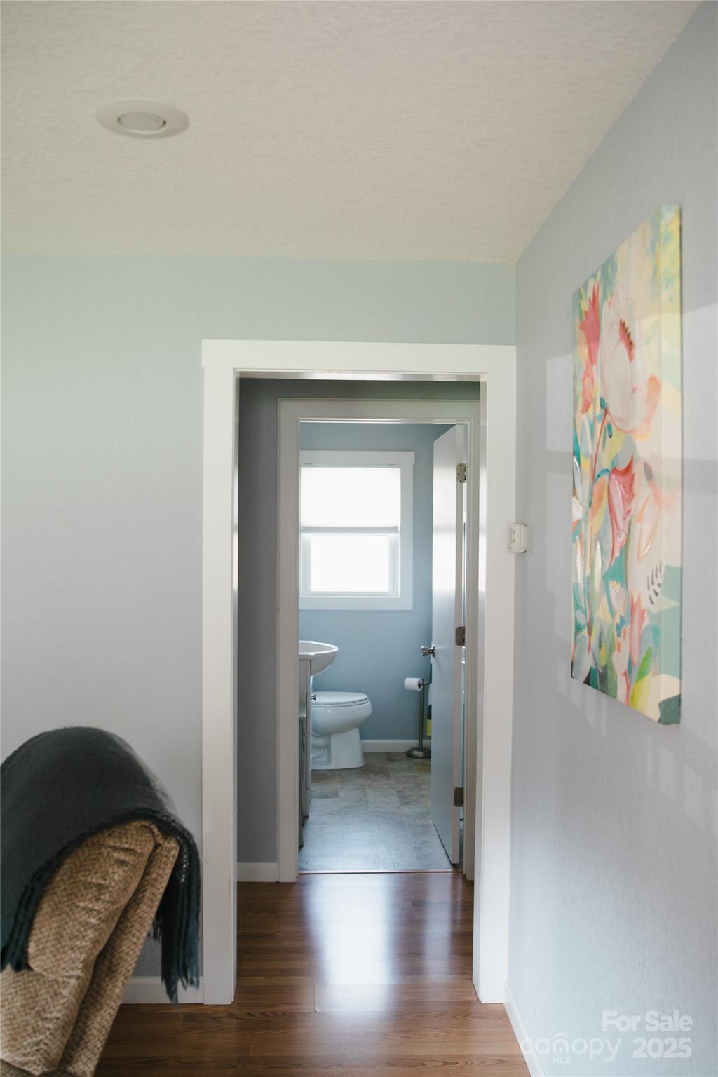 1086 Carters Ridge Road Spruce Pine, NC 28777 - Photo 26 of 47 a view of a hallway with wooden floor and a bedroom