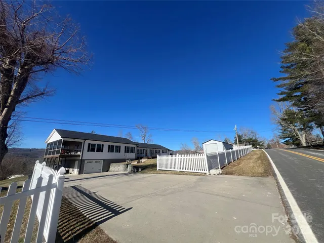 a view of a car parked in front of a building