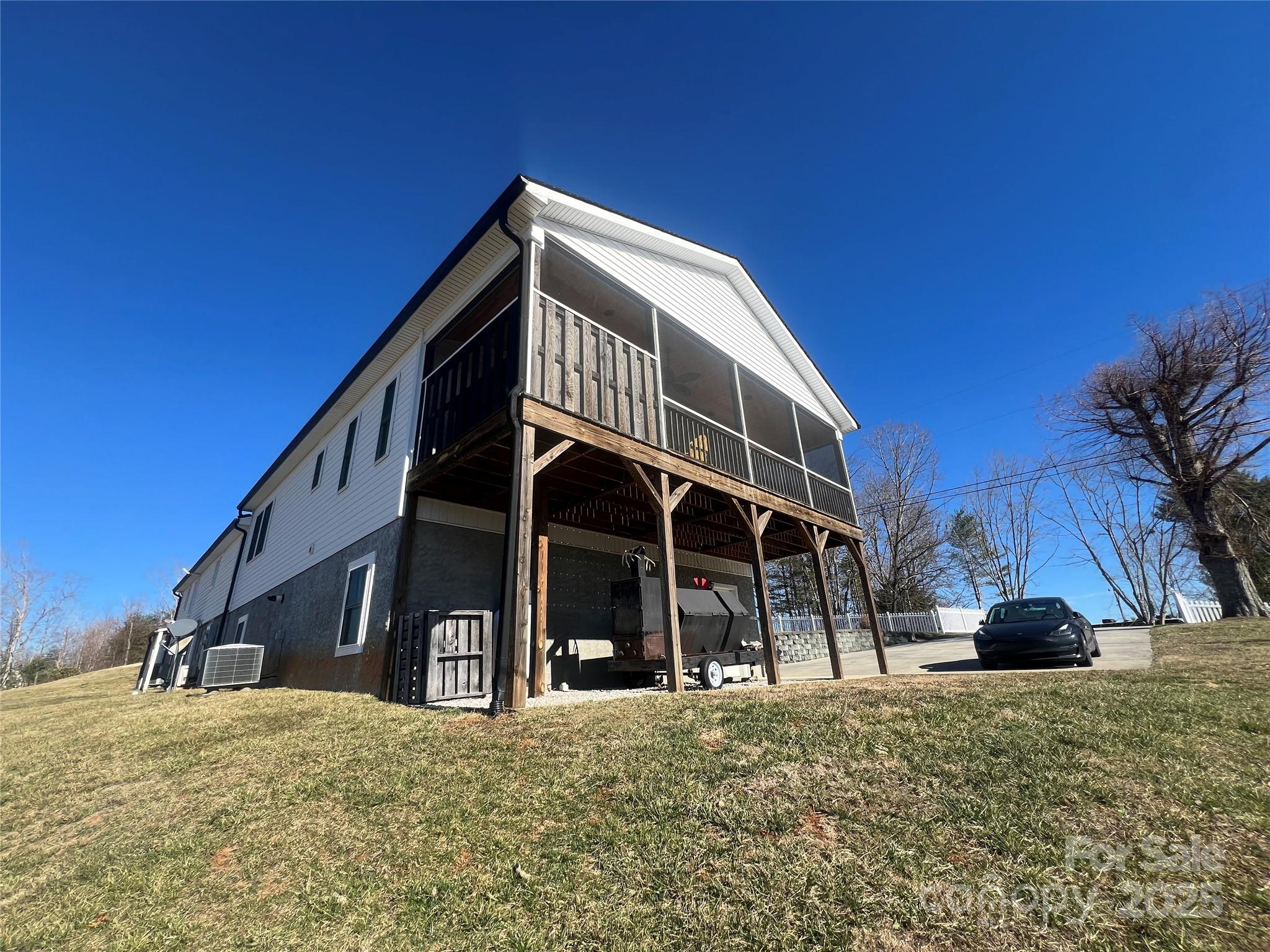 1086 Carters Ridge Road Spruce Pine, NC 28777 - Photo 37 of 47 a view of a house with a yard