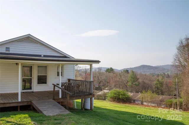 a view of a house with backyard porch and sitting area