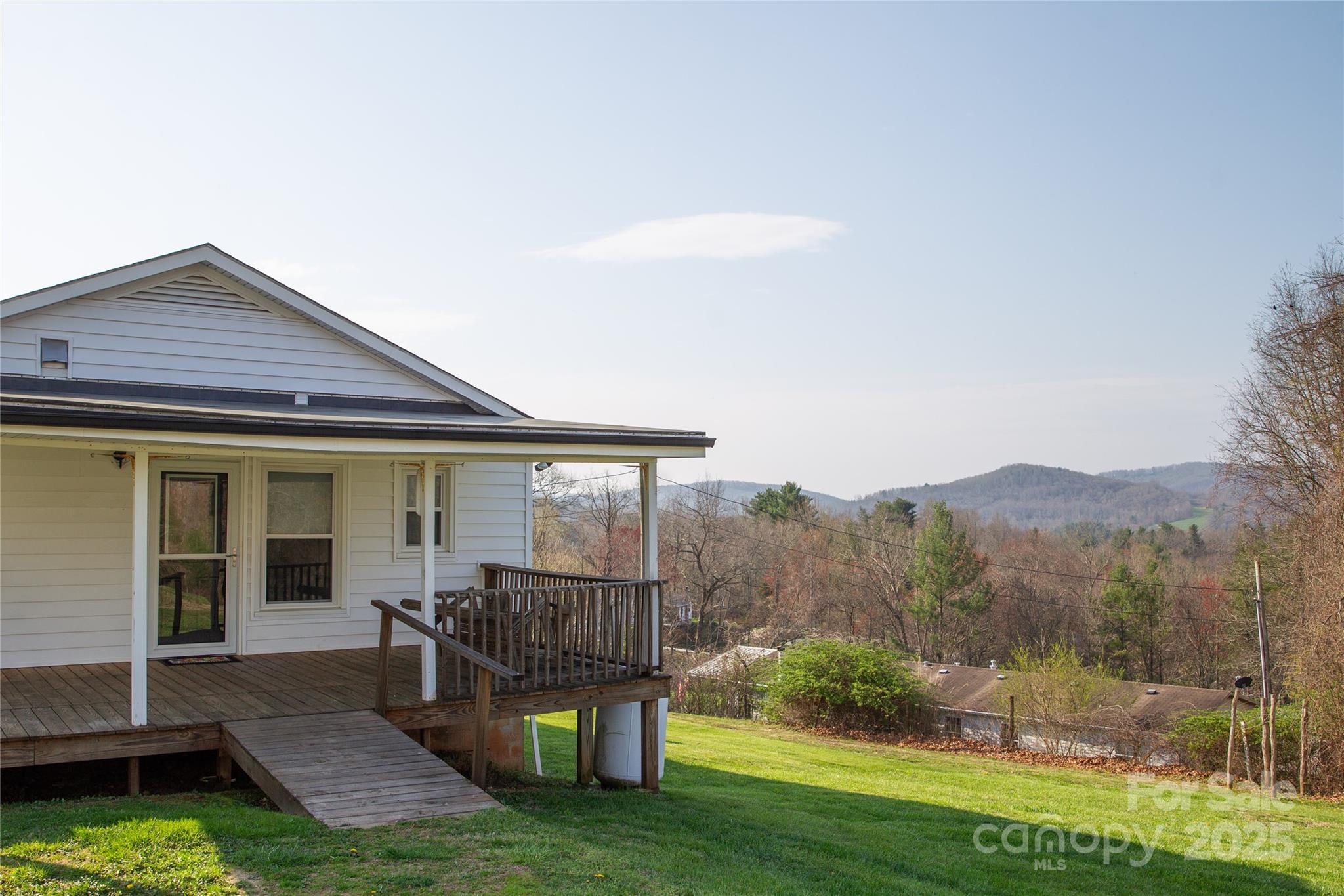 1086 Carters Ridge Road Spruce Pine, NC 28777 - Photo 40 of 47 a view of a house with backyard porch and sitting area