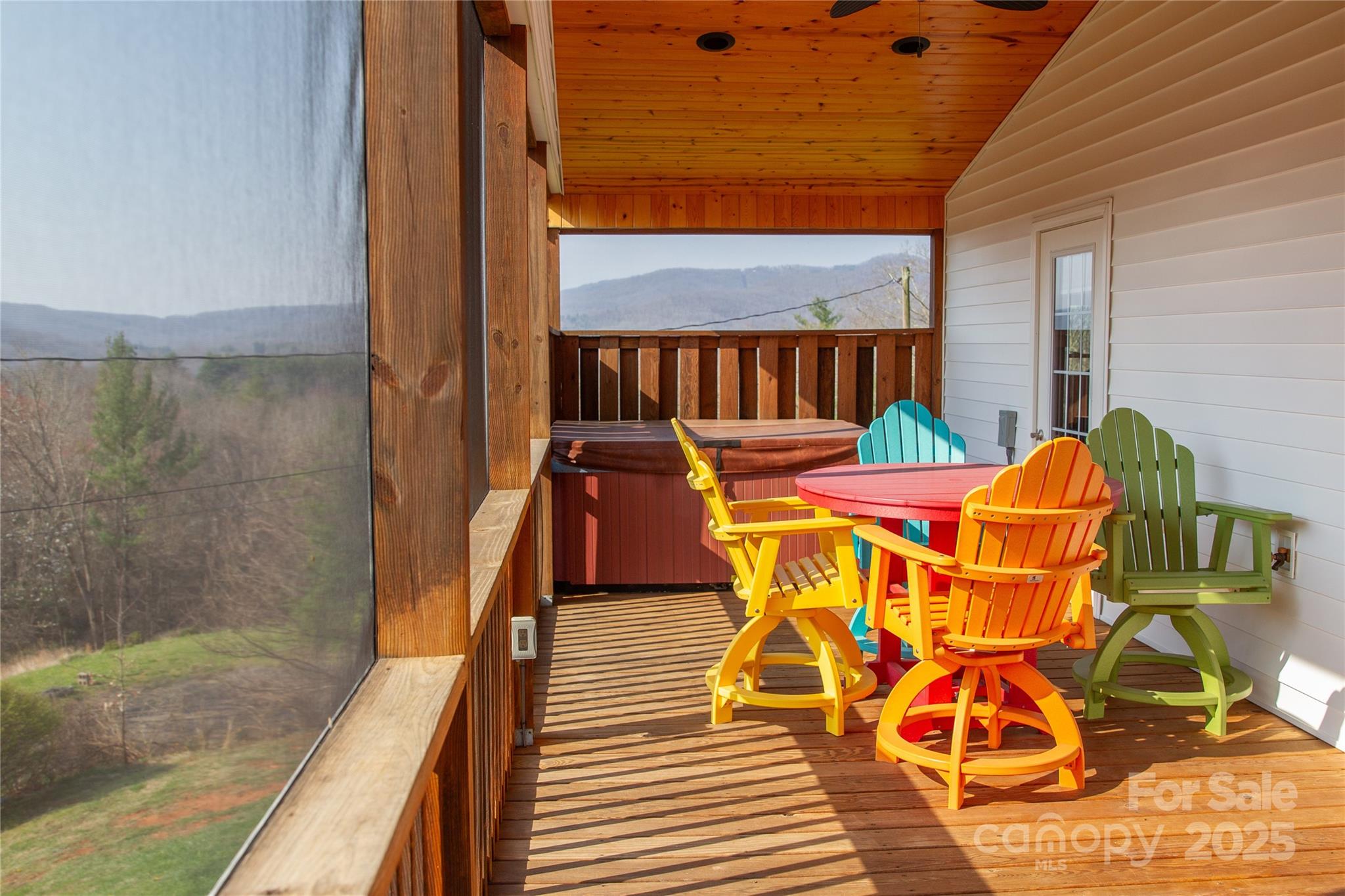 1086 Carters Ridge Road Spruce Pine, NC 28777 - Photo 4 of 47 a view of a balcony with chairs and wooden floor