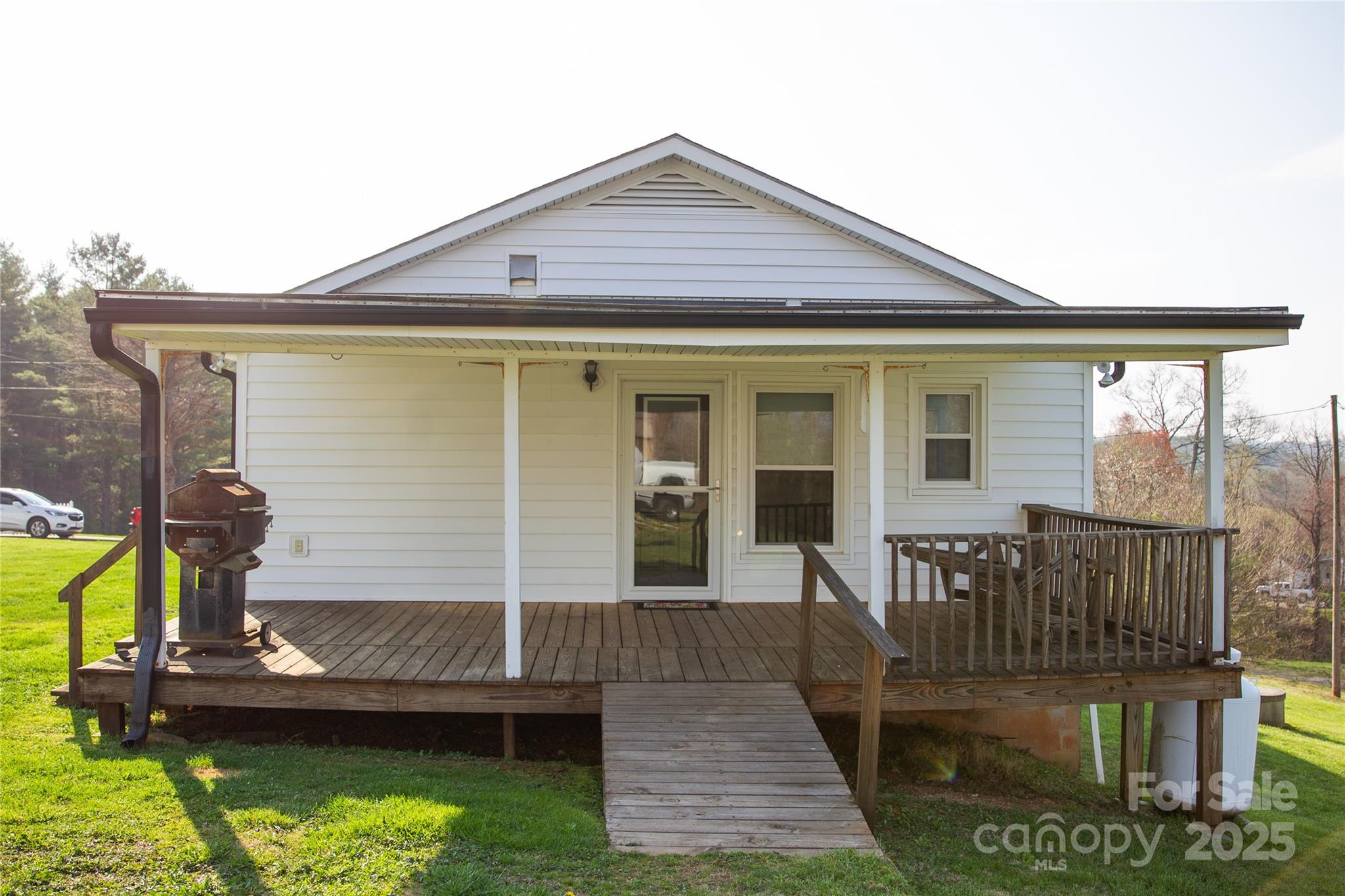 1086 Carters Ridge Road Spruce Pine, NC 28777 - Photo 41 of 47 a front view of a house with a yard