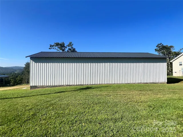 a view of a backyard of the house