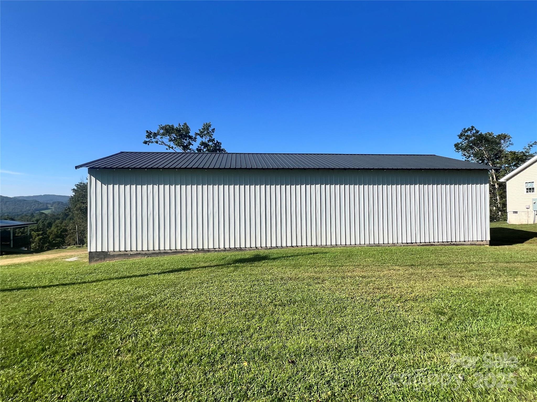 1086 Carters Ridge Road Spruce Pine, NC 28777 - Photo 46 of 47 a view of a backyard with a garden