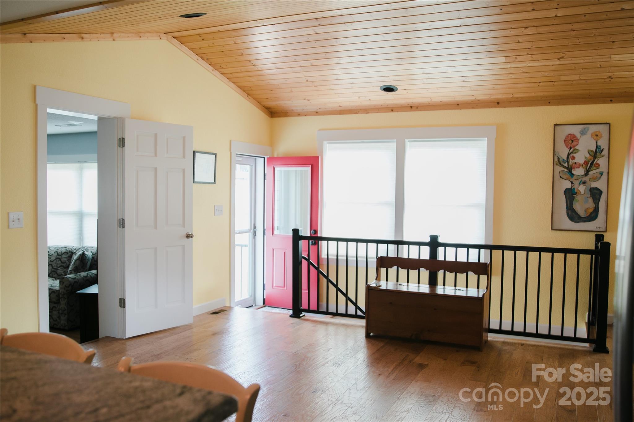1086 Carters Ridge Road Spruce Pine, NC 28777 - Photo 6 of 47 a view of a hallway with a large window and wooden floor