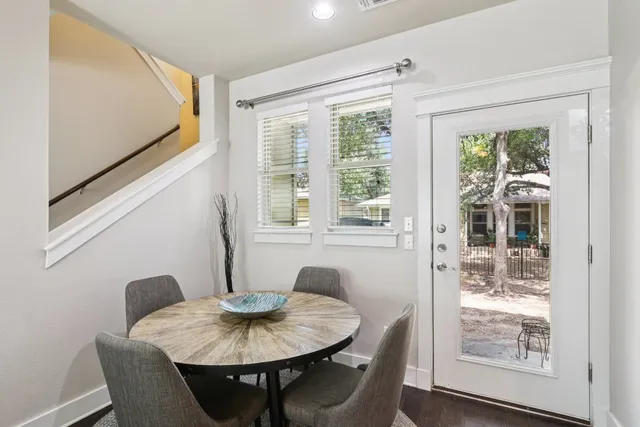 a view of a dining room with furniture window and outside view
