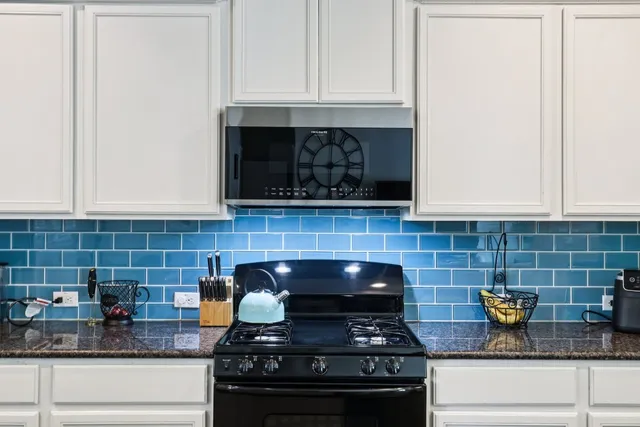 a kitchen that has a sink and a stove