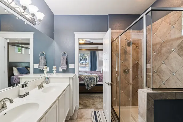a bathroom with a sink vanity and a mirror