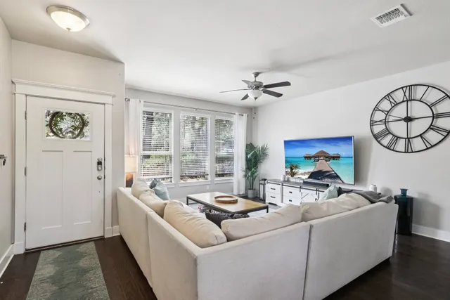 a living room with furniture and a large window